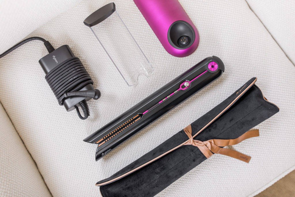 dyson flat iron with charging cord, charging dock, and packaging