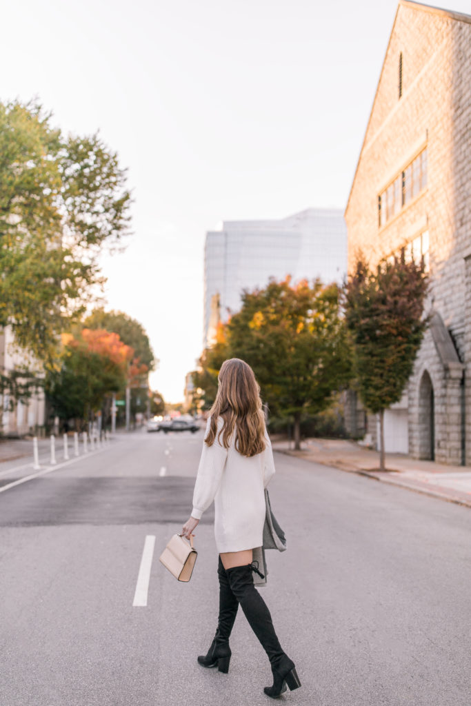 blogger wearing over the knee boots outfit with white sweater dress