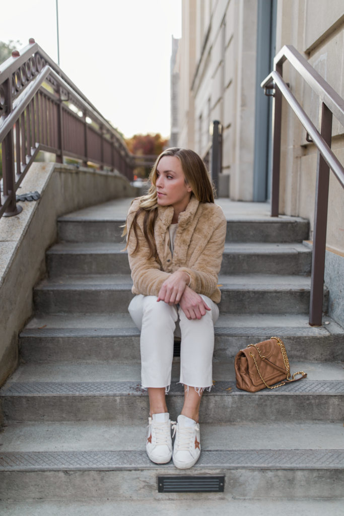 winter golden goose sneaker outfit with coat and white jeans