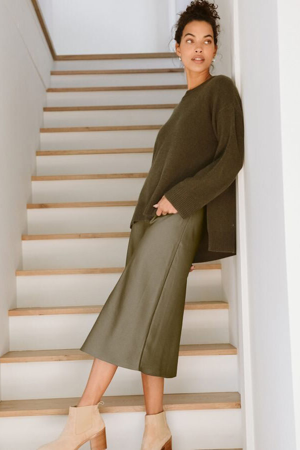 Jenni Kayne sweater styled over a slip skirt with ankle boots