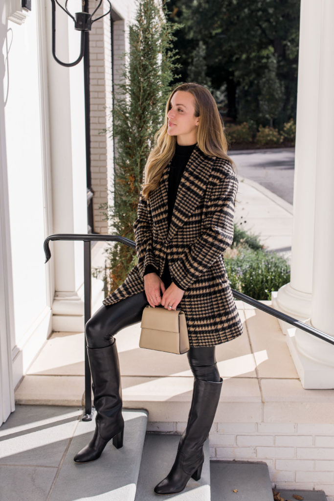 faux leather pants outfit with knee high black boots and plaid coat