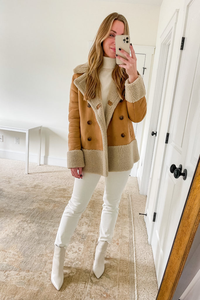 shearling jacket with white jeans and white boots