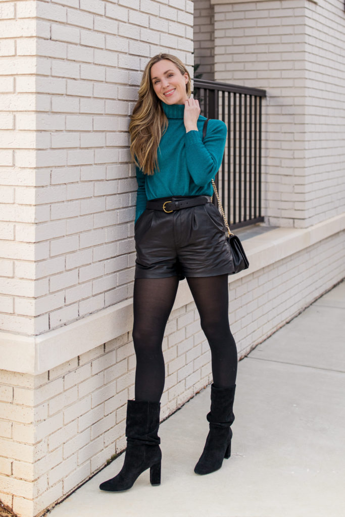 woman wearing falconer sweater and intermix leather shorts in a casual winter look