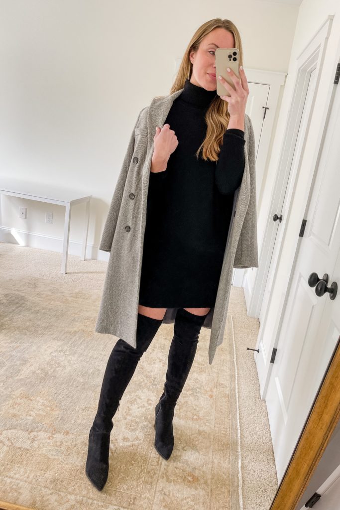woman wearing dressy cold weather outfit with black sweater dress wool coat and thigh high boots