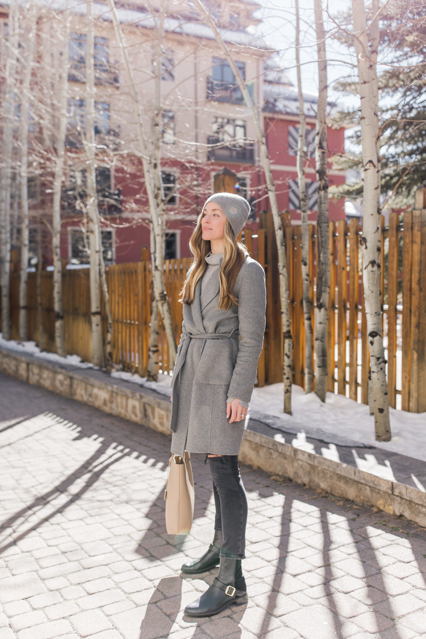 what to wear for apres ski wool coat with beanie and jeans