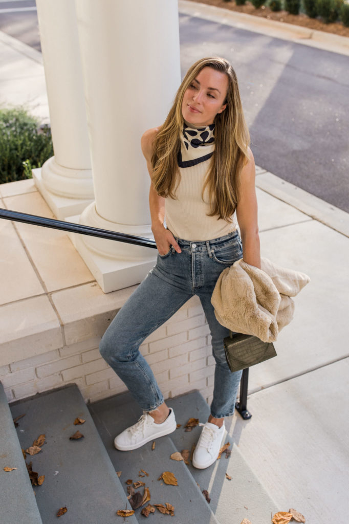 white bodysuit with scarf and light wash jeans