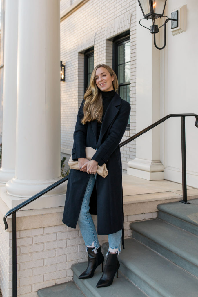 winter light blue jeans outfit with navy coat and heeled booties
