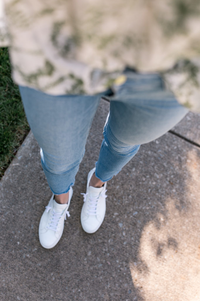 light blue jeans and white sneakers closeup