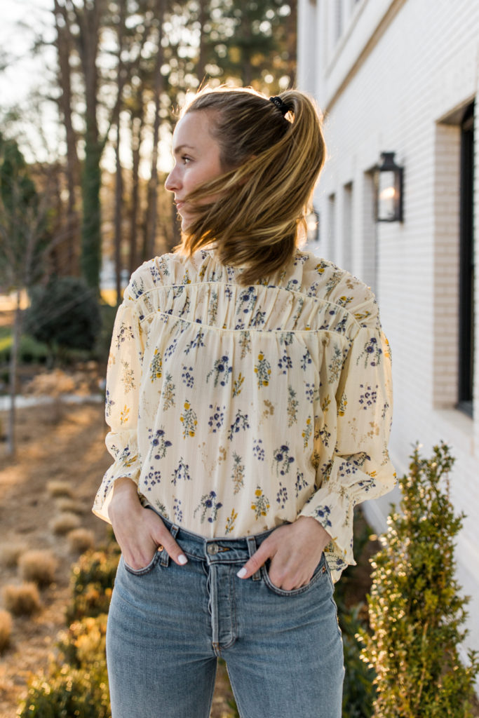 long sleeve floral top with light wash jeans