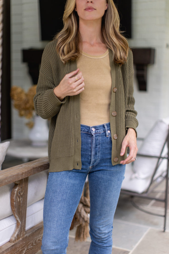 fall transition outfit with sweater, tank top, and jeans