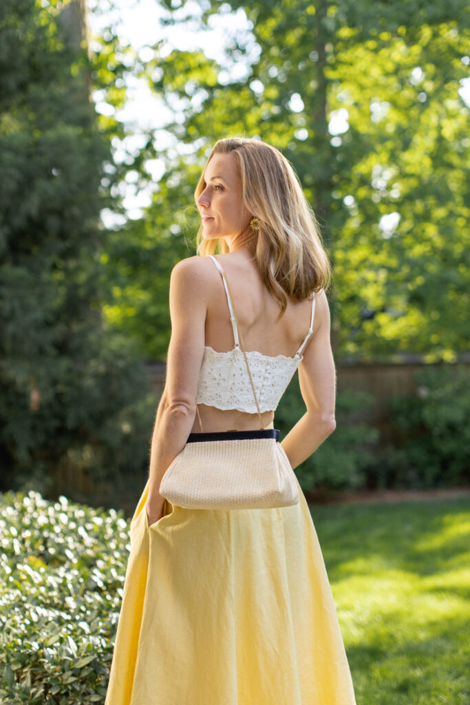 demellier straw clutch in a dressy summer outfit